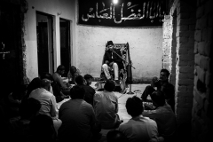 Majlis in progress. A daily occurrence, it is held twice a day, during which a Zaakir speaks on matters of faith. This culminates in a sorrow filled rendering of an incident from Karbala.