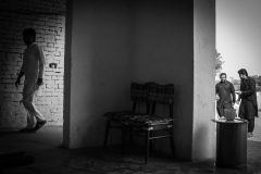 Cousins of Asghar entering the inside quarters of the house, which accommodate the women. Only close male family members are allowed to enter inside during this period.