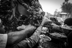Neighbours from the village feeding the horse with sweets. Considered a sacred animal, caring for Zuljanah is believed to fulfill wishes.