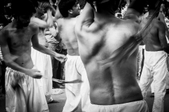 A 'maatam' procession about to begin. Called 'tatbir', men stripped bare to their waists, walk through the streets while flagellating their backs with steel blades tied to chains.