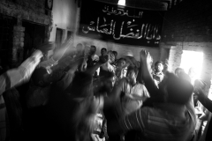 During a Majlis, amidst chants of 'Ya Hussain' and 'Ya Ali', men beat their chests in mourning, known as 'maatam'.